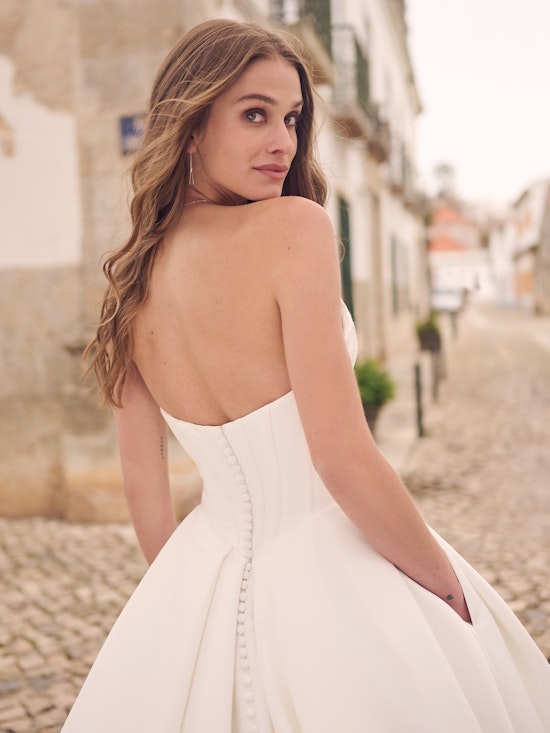 Maggie Sottero Derrick Satin V-neckline bridal gown with exposed boning details and detachable cap-sleeves